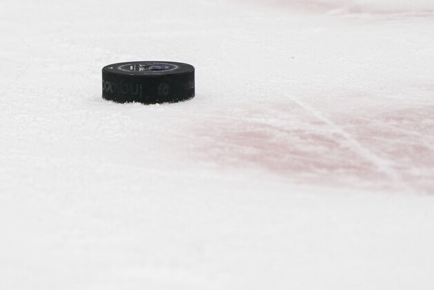 VANCOUVER, BC - FEBRUARY 22: A puck sits on the ice during NHL action between the Vancouver Canucks and the Boston Bruins at Rogers Arena on February 22, 2020 in Vancouver, Canada. (Photo by Rich Lam/Getty Images)