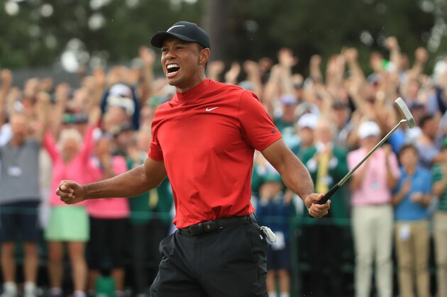 AUGUSTA, GEORGIA - APRIL 14: Tiger Woods (L) of the United States celebrates on the 18th green after winning the Masters at Augusta National Golf Club on April 14, 2019 in Augusta, Georgia. (Photo by Andrew Redington/Getty Images)