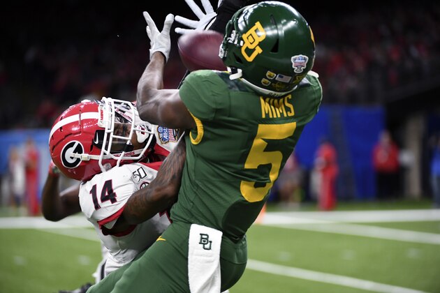 Baylor wide receiver Denzel Mims (5) tries to pull in a pass as Georgia defensive back DJ Daniel (14) defends in the first half of the Sugar Bowl NCAA college football game in New Orleans, Wednesday, Jan. 1, 2020. (AP Photo/Bill Feig)