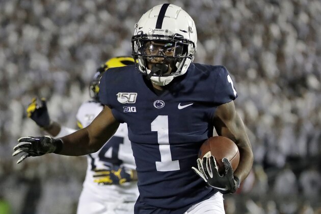 Penn State wide receiver KJ Hamler (1) scores after catching a pass from quarterback Sean Clifford during the second half of an NCAA college football game against Michigan in State College, Pa., Saturday, Oct. 19, 2019. Penn State won 28-21. (AP Photo/Gene J. Puskar)