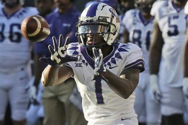 TCU wide receiver Jalen Reagor (1) reaches for a pass in the second half of an NCAA college football game against Oklahoma State in Stillwater, Okla., Saturday, Nov. 2, 2019. (AP Photo/Sue Ogrocki)