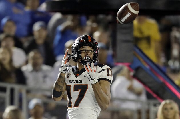 Oregon State wide receiver Isaiah Hodgins (17) catches a pass for a touchdown against UCLA during the second half of an NCAA college football game Saturday, Oct. 5, 2019, in Pasadena, Calif. (AP Photo/Marcio Jose Sanchez)