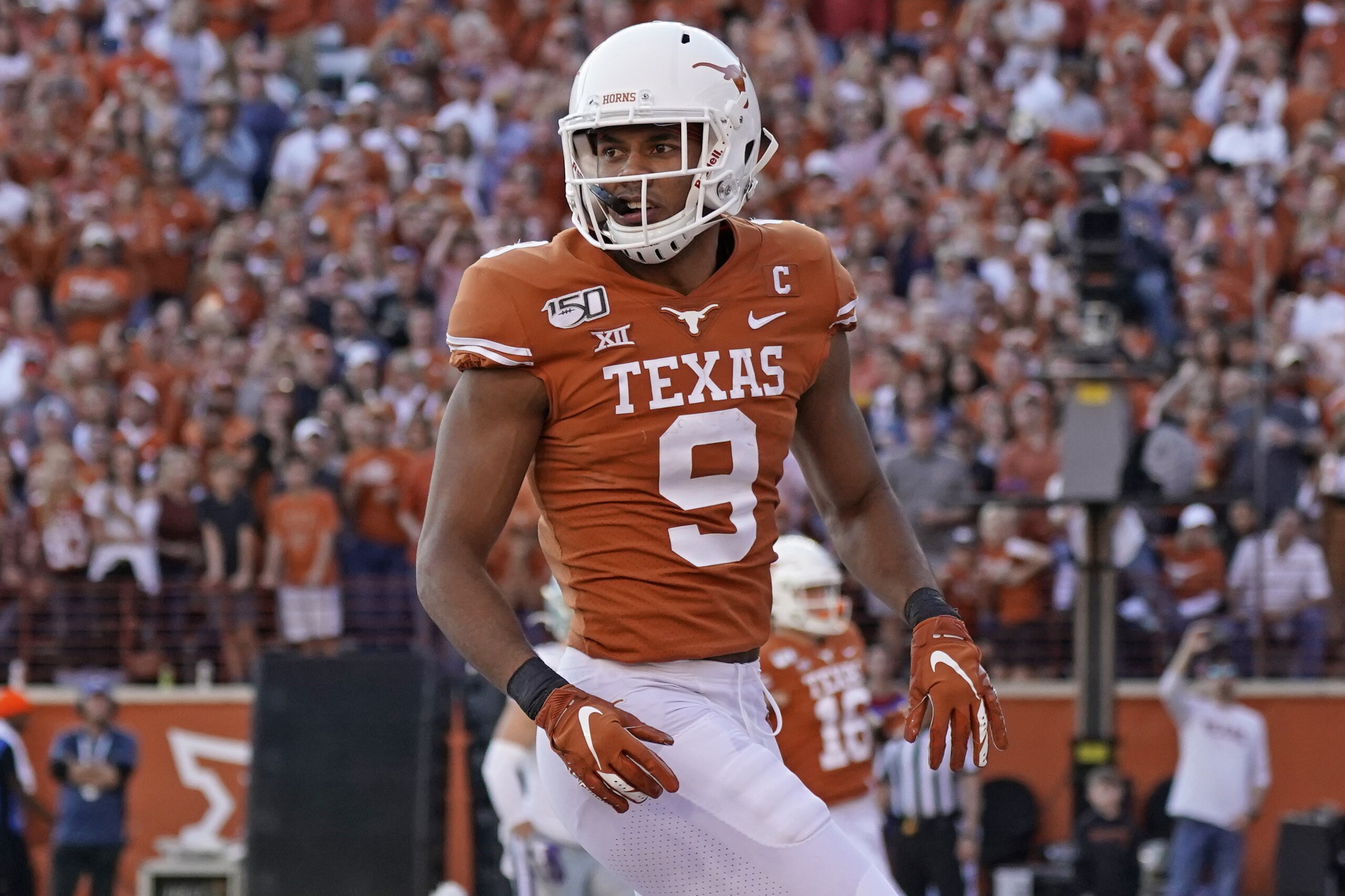Texas wide receiver Collin Johnson (9) looks back toward the bench during the second half of an NCAA college football game against Kansas State in Austin, Texas, Saturday, Nov. 9, 2019. (AP Photo/Chuck Burton)
