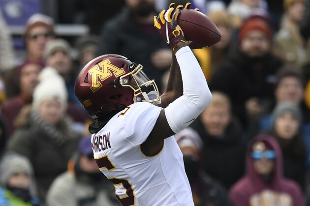 FILE - In this Nov. 23, 2019, file photo, Minnesota wide receiver Tyler Johnson (6) catches a touchdown pass over Northwestern cornerback Cam Ruiz (18) during the second half of an NCAA football game, in Evanston, Ill. Tyler Johnson  was selected to The Associated Press All-Big Conference team, Wednesday, Dec. 11, 2019. (AP Photo/Paul Beaty, File)