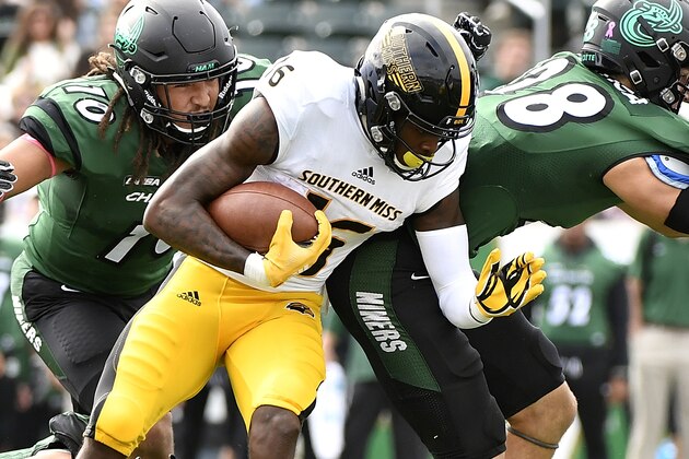 CHARLOTTE, NC - OCTOBER 27: Wide receiver Quez Watkins #16 of the Southern Miss Golden Eagles while being pursued by defensive end Tyriq Harris #10 of the Charlotte 49ers during the football game at Jerry Richardson Stadium on October 27, 2018 in Charlotte, North Carolina. (Photo by Mike Comer/Getty Images)