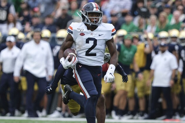 Virginia wide receiver Joe Reed (2) runs infront of Notre Dame cornerback Troy Pride Jr. (5) in the first half of an NCAA college football game in South Bend, Ind., Saturday, Sept. 28, 2019. (AP Photo/AJ Mast)
