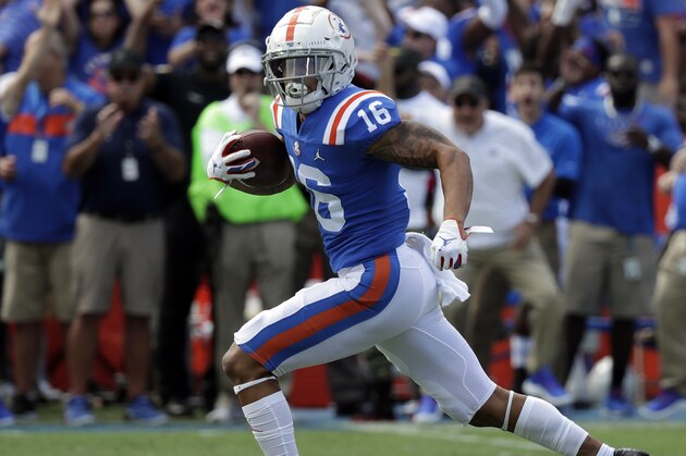 Florida wide receiver Freddie Swain (16) runs from the Auburn defense on his way to a 64-yard touchdown during the first half of an NCAA college football game, Saturday, Oct. 5, 2019, in Gainesville, Fla. (AP Photo/John Raoux)