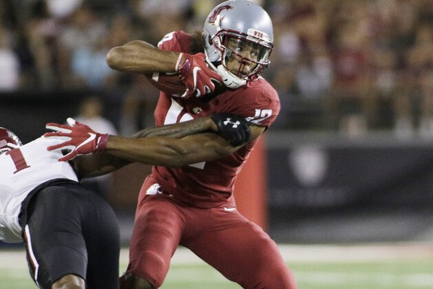 Washington State wide receiver Dezmon Patmon, left, gets past New Mexico State defensive back Ray Buford Jr. during the first half of an NCAA college football game in Pullman, Wash., Saturday, Aug. 31, 2019. (AP Photo/Young Kwak)