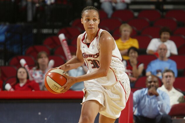 HOUSTON - JUNE 2:  Tamara Moore #30 of the Houston Comets moves the ball against the Detroit Shock during the WNBA game on June 2, 2007 at Toyota Center in Houston, Texas. The Shock won 77-71. NOTE TO USER: User expressly acknowledges and agrees that, by downloading and/or using this Photograph, user is consenting to the terms and conditions of the Getty Images License Agreement. Mandatory Copyright Notice: Copyright 2007 NBAE (Photo by Bill Baptist/NBAE via Getty Images)