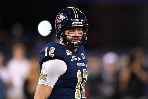 MIAMI, FLORIDA - NOVEMBER 23: James Morgan #12 of the FIU Golden Panthers looks to pass against the Miami Hurricanes in the first half at Marlins Park on November 23, 2019 in Miami, Florida. (Photo by Mark Brown/Getty Images)