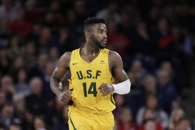 San Francisco guard Charles Minlend (14) runs on the court during the second half of an NCAA college basketball game against Gonzaga in Spokane, Wash., Thursday, Feb. 20, 2020. (AP Photo/Young Kwak)