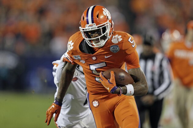 Clemson wide receiver Tee Higgins (5) runs against Virginia during the first half of the Atlantic Coast Conference championship NCAA college football game in Charlotte, N.C., Saturday, Dec. 7, 2019. (AP Photo/Gerry Broome)