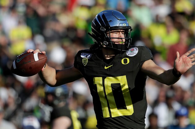 Oregon quarterback Justin Herbert passes against Wisconsin during first half of the Rose Bowl NCAA college football game Wednesday, Jan. 1, 2020, in Pasadena, Calif. (AP Photo/Marcio Jose Sanchez)