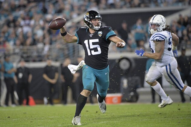 Jacksonville Jaguars quarterback Gardner Minshew II (15) throws a pass in front of Indianapolis Colts defensive end Jabaal Sheard, right, during the second half of an NFL football game Sunday, Dec. 29, 2019, in Jacksonville, Fla. (AP Photo/Phelan M. Ebenhack)