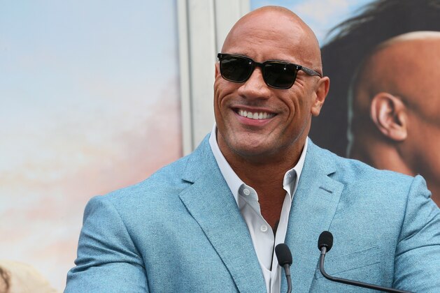 HOLLYWOOD, CALIFORNIA - DECEMBER 10: Dwayne Johnson attends a Hand and Footprint ceremony honoring Kevin Hart at the TCL Chinese Theatre IMAX on December 10, 2019 in Hollywood, California. (Photo by Jean Baptiste Lacroix/Getty Images)
