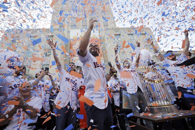 Houston Astros' Jose Altuve, center, and his teammates celebrate during a rally honoring the World Series baseball champions Friday, Nov. 3, 2017, in Houston. (AP Photo/David J. Phillip)