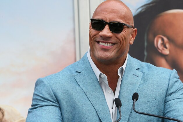 HOLLYWOOD, CALIFORNIA - DECEMBER 10: Dwayne Johnson attends a Hand and Footprint ceremony honoring Kevin Hart at the TCL Chinese Theatre IMAX on December 10, 2019 in Hollywood, California. (Photo by Jean Baptiste Lacroix/Getty Images) HOLLYWOOD, CALIFORNIA - DECEMBER 10: Dwayne Johnson attends a Hand and Footprint ceremony honoring Kevin Hart at the TCL Chinese Theatre IMAX on December 10, 2019 in Hollywood, California. (Photo by Jean Baptiste Lacroix/Getty Images)