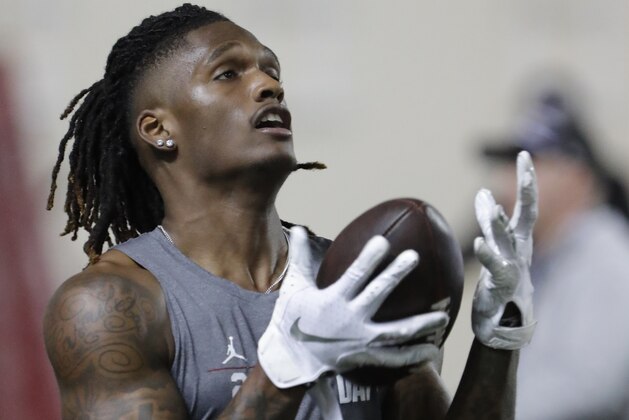 Oklahoma wide receiver CeeDee Lamb catches a pass during drills at Pro Day for NFL football scouts and coaches in Norman, Okla., Wednesday, March 11, 2020. (AP Photo/Alonzo Adams)
