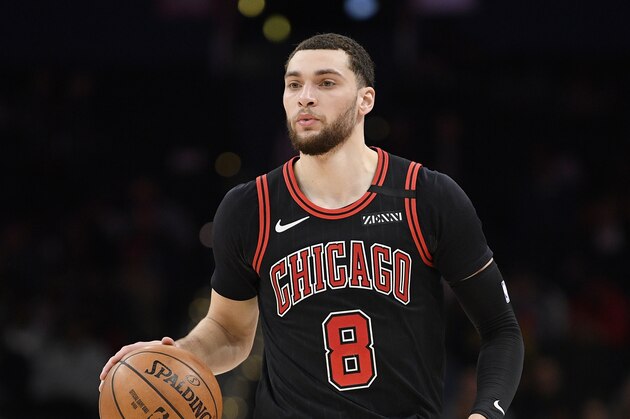 Chicago Bulls guard Zach LaVine (8) dribbles the ball during the first half of an NBA basketball game against the Washington Wizards, Tuesday, Feb. 11, 2020, in Washington. (AP Photo/Nick Wass)