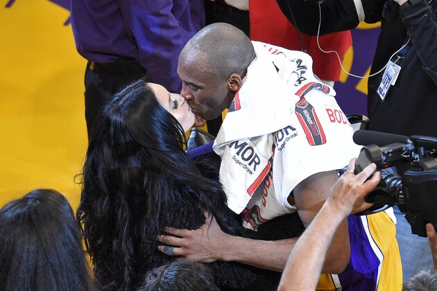 Los Angeles Lakers forward Kobe Bryant kisses his wife, Vanessa, after an NBA basketball game against the Utah Jazz, Wednesday, April 13, 2016, in Los Angeles. Bryant scored 60 points in what he said is his final NBA game as the Lakers won 101-96. (AP Photo/Mark J. Terrill)