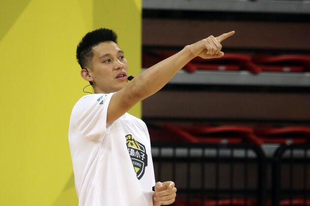 Former Toronto Raptors' Jeremy Lin, currently a free agent, speaks to young Taiwanese players during a basketball clinic in Taipei, Taiwan, Saturday, July 27, 2019. Lin is in Taiwan to attend a charity event and basketball clinics for young athletes. (AP Photo/Chiang Ying-ying)