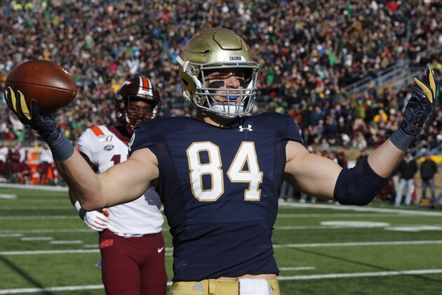 Notre Dame tight end Cole Kmet (84) celebrates an 8-yard touchdown reception during the first half of an NCAA college football game against Virginia Tech, Saturday, Nov. 2, 2019, in South Bend, Ind. (AP Photo/Carlos Osorio)