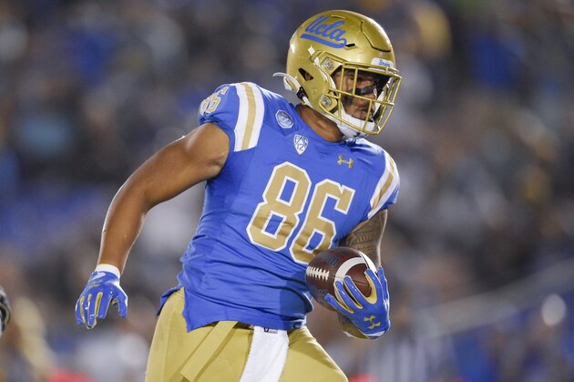 UCLA tight end Devin Asiasi catches a pass for a touchdown during the first half of an NCAA college football game against Colorado in Los Angeles, Saturday, Nov. 2, 2019. (AP Photo/Kelvin Kuo)