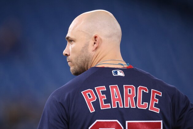 TORONTO, ON - MAY 21: Steve Pearce #25 of the Boston Red Sox waits on first base during a pitching change in the seventh inning during MLB game action against the Toronto Blue Jays at Rogers Centre on May 21, 2019 in Toronto, Canada. (Photo by Tom Szczerbowski/Getty Images)