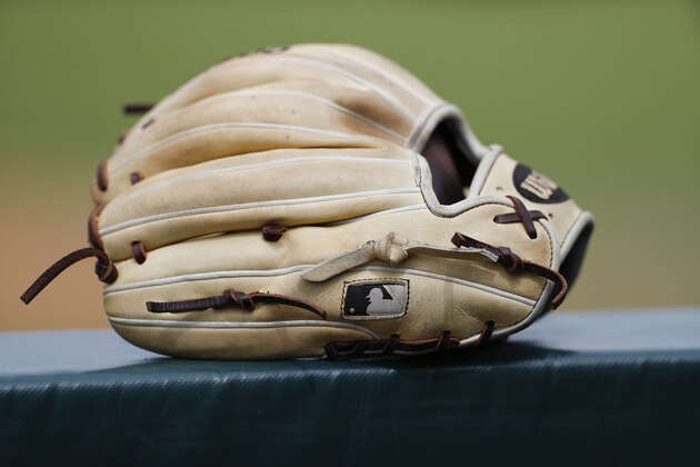 A detail view of a baseball glove with the MLB logo during a Northwestern State University at Houston Baptist University NCAA college baseball game, Saturday, March 30, 2019, in Houston. (AP Photo/Aaron M. Sprecher)