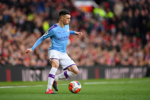 MANCHESTER, ENGLAND - MARCH 08: Phil Foden of Manchester City runs with the ball during the Premier League match between Manchester United and Manchester City at Old Trafford on March 08, 2020 in Manchester, United Kingdom. (Photo by Laurence Griffiths/Getty Images)