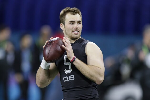 Georgia quarterback Jake Fromm runs a drill at the NFL football scouting combine in Indianapolis, Thursday, Feb. 27, 2020. (AP Photo/Michael Conroy)