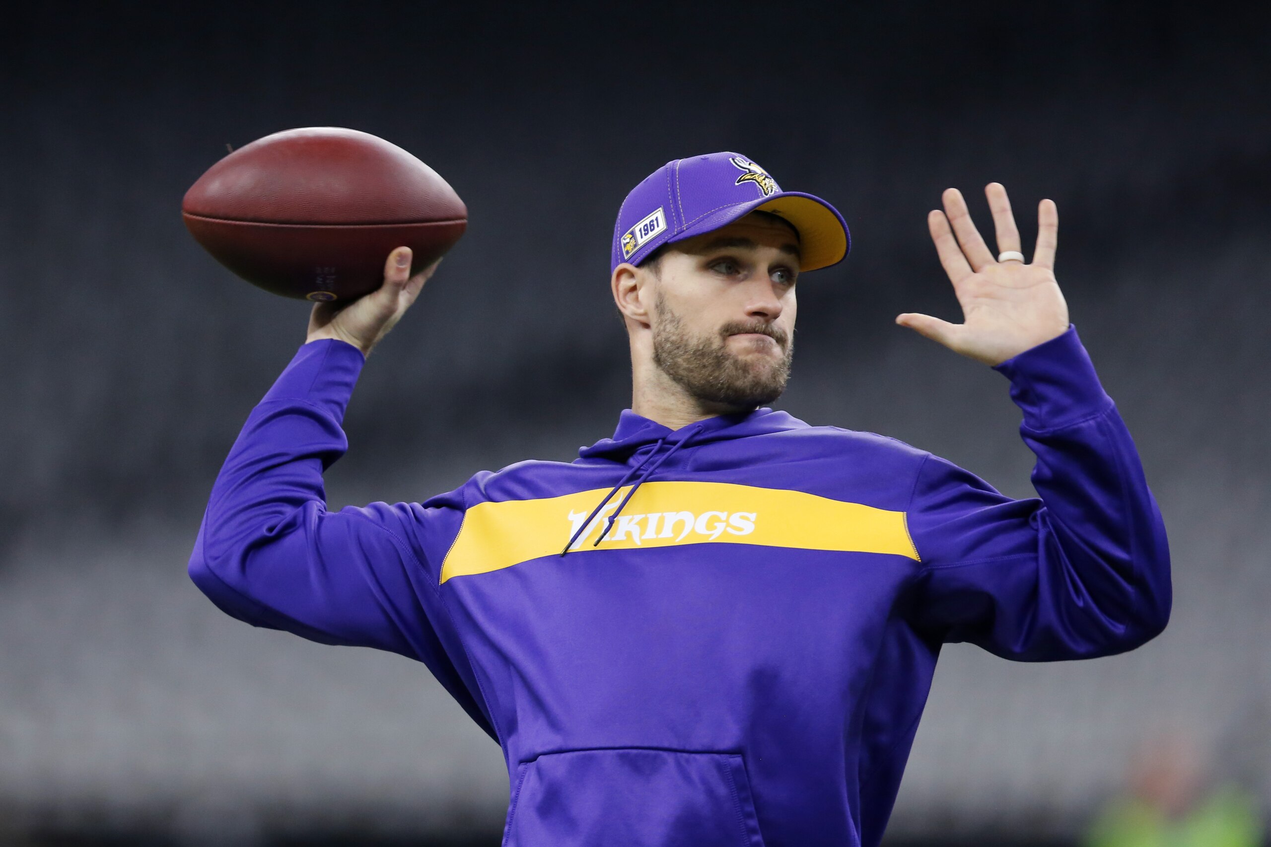 Minnesota Vikings quarterback Kirk Cousins warms up before an NFL wild-card playoff football game against the New Orleans Saints, Sunday, Jan. 5, 2020, in New Orleans. (AP Photo/Brett Duke)