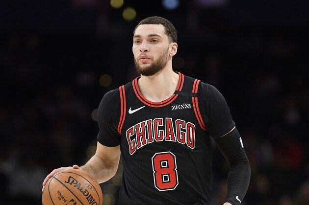 Chicago Bulls guard Zach LaVine (8) dribbles the ball during the first half of an NBA basketball game against the Washington Wizards, Tuesday, Feb. 11, 2020, in Washington. (AP Photo/Nick Wass)