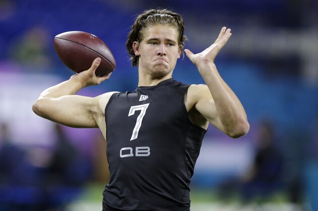 Oregon quarterback Justin Herbert runs a drill at the NFL football scouting combine in Indianapolis, Thursday, Feb. 27, 2020. (AP Photo/Michael Conroy)