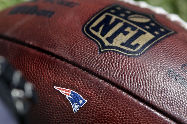 The New England Patriots logo adorns a football during practice at the NFL football team's training camp in Foxborough, Mass., Thursday, May 31, 2018. (AP Photo/Charles Krupa)