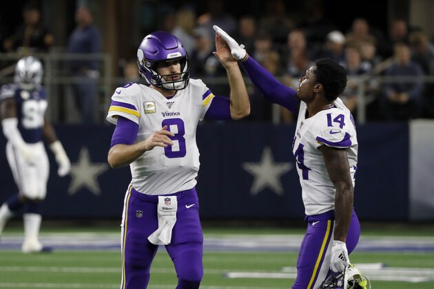 Minnesota Vikings quarterback Kirk Cousins (8) is congratulated by wide receiver Stefon Diggs (14) after a touchdown during the first half of an NFL football game against the Dallas Cowboys in Arlington, Texas, Sunday, Nov. 10, 2019. (AP Photo/Roger Steinman)