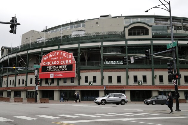 A photo is seen at Wrigley Field which is Cubs stadium in Chicago, Sunday, March 29, 2020. Two Cubs employees tested positive for COVID-19 after attending a training session at Wrigley Field earlier this month. (AP Photo/Nam Y. Huh) A photo is seen at Wrigley Field which is Cubs stadium in Chicago, Sunday, March 29, 2020. Two Cubs employees tested positive for COVID-19 after attending a training session at Wrigley Field earlier this month. (AP Photo/Nam Y. Huh)