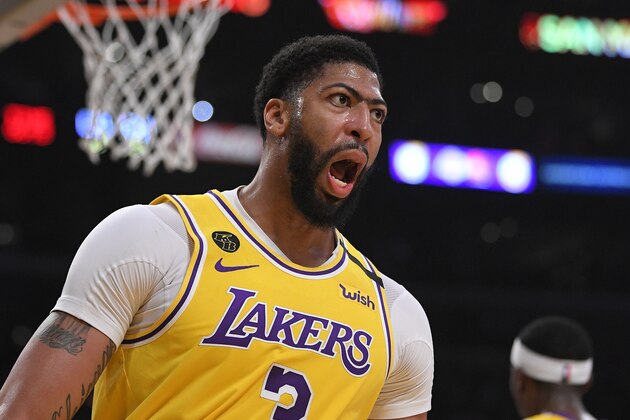 Los Angeles Lakers forward Anthony Davis reacts after scoring during the first half of an NBA basketball game against the Philadelphia 76ers Tuesday, March 3, 2020, in Los Angeles. (AP Photo/Mark J. Terrill)
