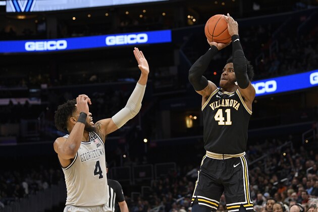 Villanova forward Saddiq Bey (41) shoots against Georgetown guard Jagan Mosely (4) during the first half of an NCAA college basketball game, Saturday, March 7, 2020, in Washington. (AP Photo/Nick Wass)