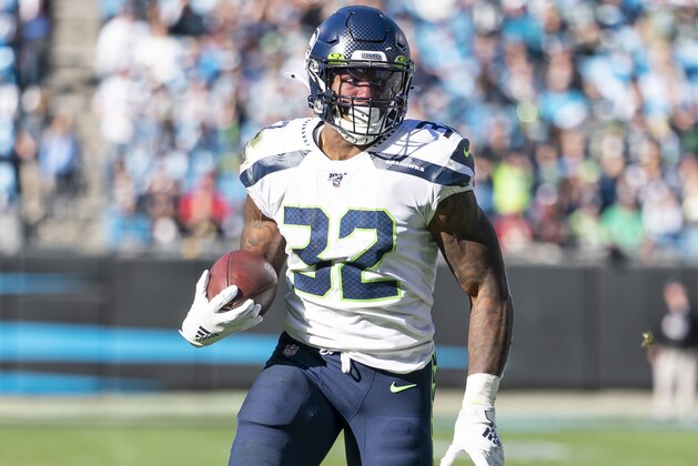 CHARLOTTE, NC - DECEMBER 15: Chris Carson #32 of the Seattle Seahawks runs with the ball during a game between Seattle Seahawks and Carolina Panthers at Bank of America Stadium on December 15, 2019 in Charlotte, North Carolina. (Photo by Steve Limentani/ISI Photos/Getty Images)