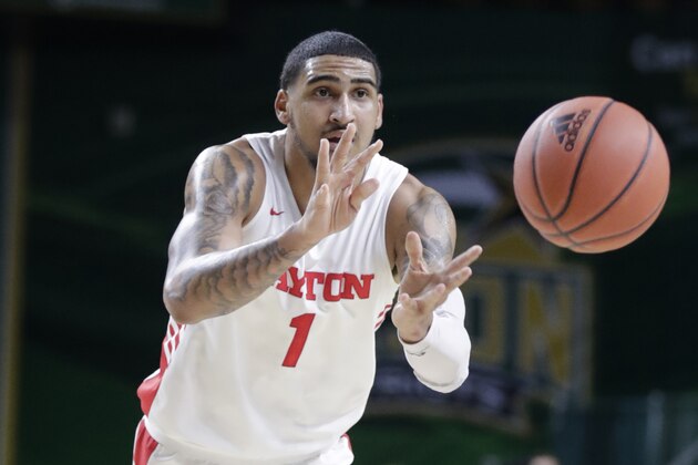 Dayton's Obi Toppin (1) passes the ball during the first half of an NCAA college basketball game against George Mason, Tuesday, Feb. 25, 2020, in Fairfax, Va. (AP Photo/Luis M. Alvarez)