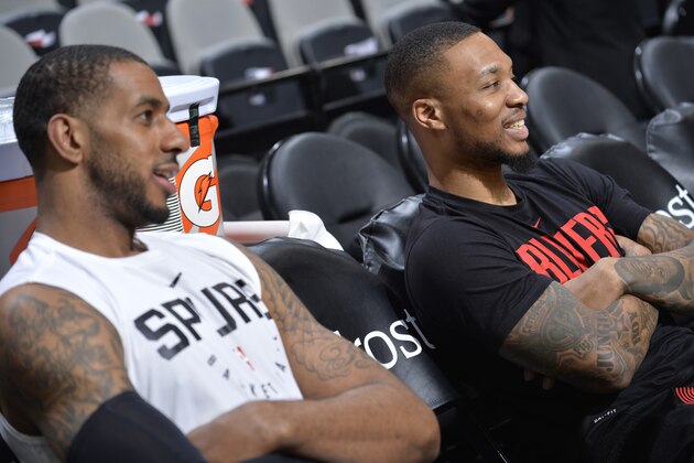SAN ANTONIO, TX - MARCH 16: LaMarcus Aldridge #12 of the San Antonio Spurs and Damian Lillard #0 of the Portland Trail Blazers talks before the game on March 16, 2019 at the AT&T Center in San Antonio, Texas. NOTE TO USER: User expressly acknowledges and agrees that, by downloading and or using this photograph, user is consenting to the terms and conditions of the Getty Images License Agreement. Mandatory Copyright Notice: Copyright 2019 NBAE (Photos by Mark Sobhani/NBAE via Getty Images)