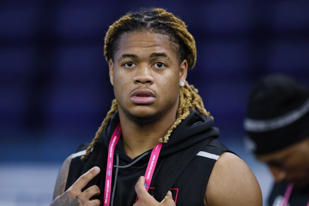 Ohio State defensive lineman Chase Young watches a drill at the NFL football scouting combine in Indianapolis, Saturday, Feb. 29, 2020. (AP Photo/Charlie Neibergall)