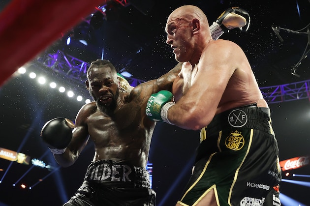 LAS VEGAS, NEVADA - FEBRUARY 22:  Tyson Fury punches Deontay Wilder during their Heavyweight bout for Wilder's WBC and Fury's lineal heavyweight title on February 22, 2020 at MGM Grand Garden Arena in Las Vegas, Nevada. (Photo by Al Bello/Getty Images)