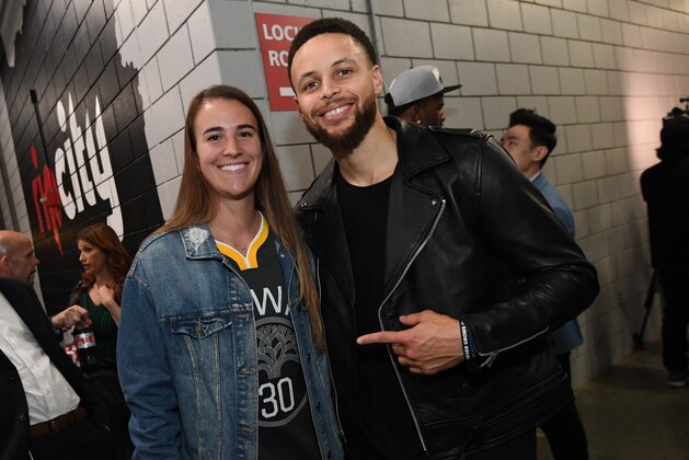 PORTLAND, OR - MAY 20: Stephen Curry #30 of the Golden State Warriors poses for a photo with Oregon Ducks Basketball player, Sabrina Ionescu, after advancing to the NBA Finals against the Portland Trail Blazers during Game Four of the Western Conference Finals on May 20, 2019 at the Moda Center in Portland, Oregon. NOTE TO USER: User expressly acknowledges and agrees that, by downloading and/or using this photograph, user is consenting to the terms and conditions of the Getty Images License Agreement. Mandatory Copyright Notice: Copyright 2019 NBAE (Photo by Noah Graham/NBAE via Getty Images)