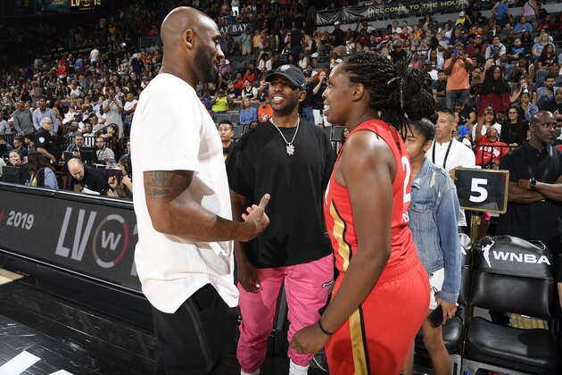 LAS VEGAS, NV - JULY 27: NBA legend, Kobe Bryant, shares a conversation with Chris Paul #3 of the Oklahoma City Thunder and Chelsea Gray #12 of Team Wilson during the AT&T WNBA All-Star Game 2019 on July 27, 2019 at the Mandalay Bay Events Center in Las Vegas, Nevada. NOTE TO USER: User expressly acknowledges and agrees that, by downloading and or using this photograph, user is consenting to the terms and conditions of the Getty Images License Agreement. Mandatory Copyright Notice: Copyright 2019 NBAE (Photo by Brian Babineau/NBAE via Getty Images)