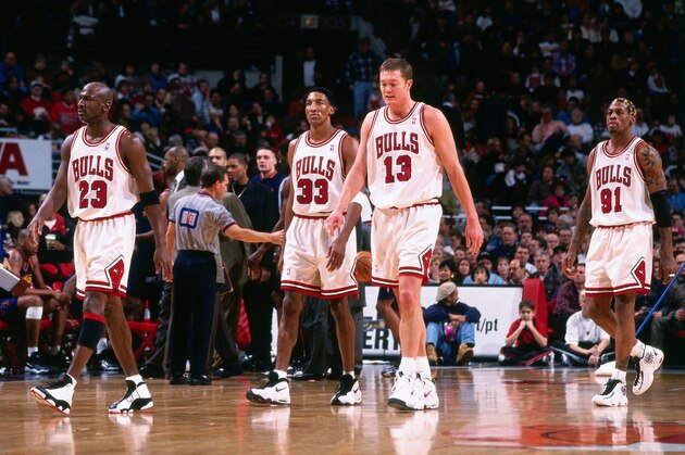 CHICAGO, IL - JANUARY 10: Michael Jordan #23, Scottie Pippen #33, Luc Longley #13, and Dennis Rodman #91 of the Chicago Bulls look on during the game against the Golden State Warriors on January 10, 1998 at the United Center in Chicago, Illinois. NOTE TO USER: User expressly acknowledges and agrees that, by downloading and/or using this photograph, user is consenting to the terms and conditions of the Getty Images License Agreement. Mandatory Copyright Notice: Copyright 1998 NBAE (Photo by Steve Woltmann/NBAE via Getty Images)