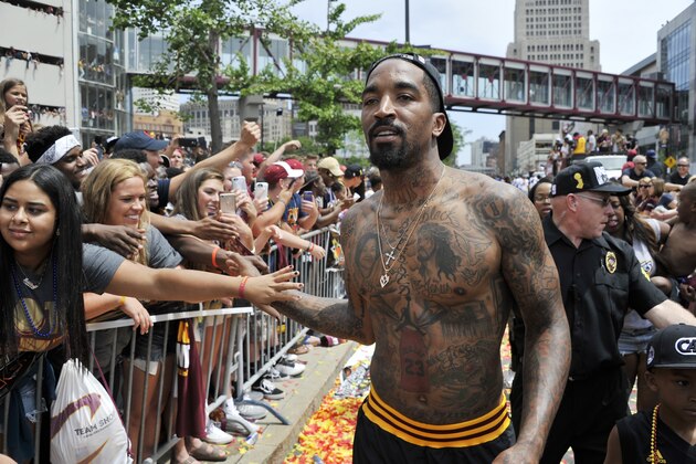 CLEVELAND, OH - JUNE 22:  J.R. Smith #5 of the Cleveland Cavaliers shakes hands with the fans during the Cleveland Cavaliers Victory Parade And Rally on June 22, 2016 in downtown Cleveland, Ohio.  NOTE TO USER: User expressly acknowledges and agrees that, by downloading and/or using this Photograph, user is consenting to the terms and conditions of the Getty Images License Agreement. Mandatory Copyright Notice: Copyright 2016 NBAE  (Photo by David Liam Kyle/NBAE via Getty Images)