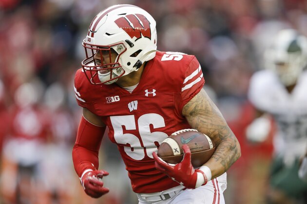 Wisconsin linebacker Zack Baun (56) returns an interception for a touchdown against Michigan State wide receiver C.J. Hayes (4) during the second half of an NCAA college football game Saturday, Oct. 12, 2019, in Madison, Wis. Wisconsin won 38-0. (AP Photo/Andy Manis)