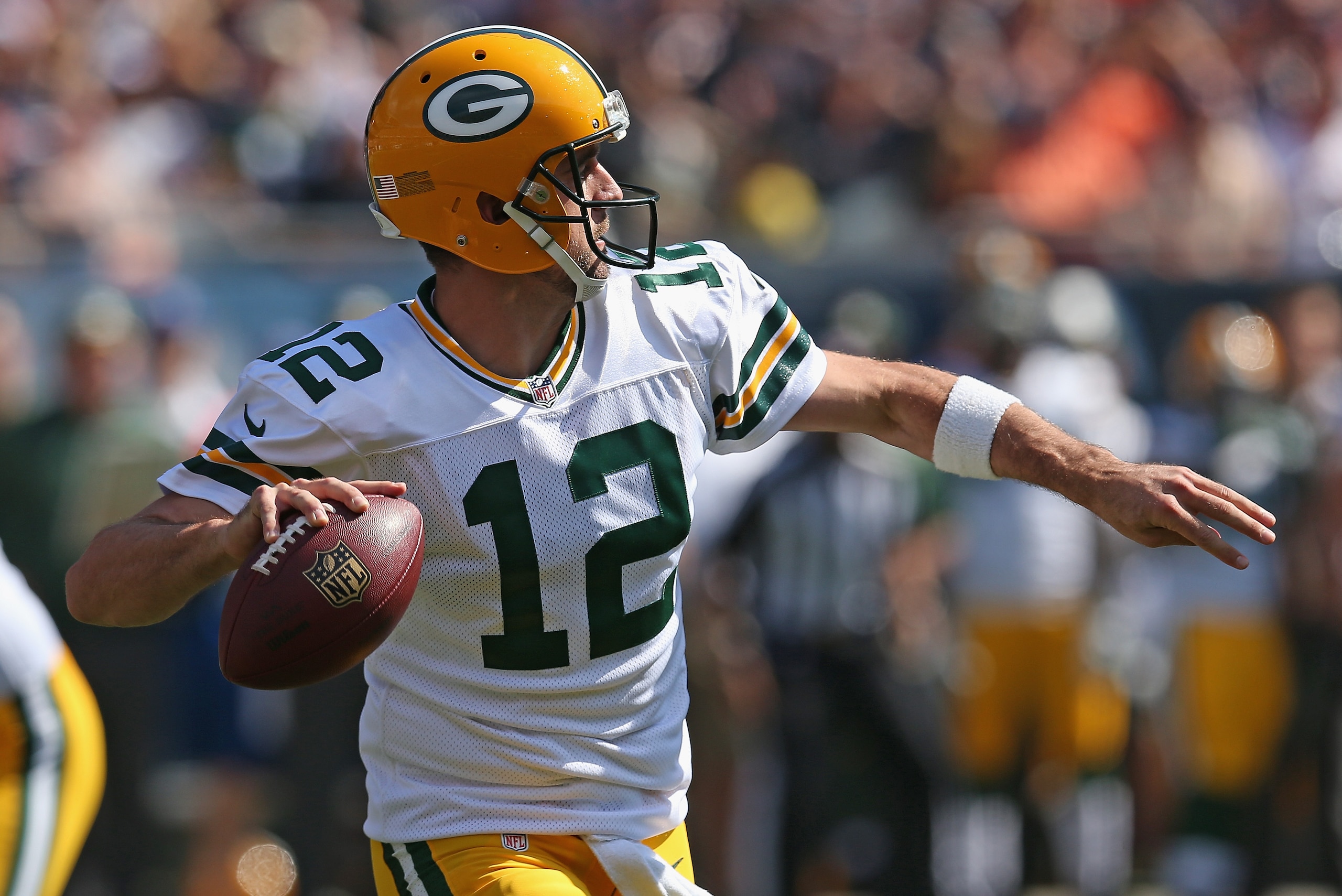 CHICAGO, IL - SEPTEMBER 28:  Aaron Rodgers #12 of the Green Bay Packers passes against the Chicago Bears at Soldier Field on September 28, 2014 in Chicago, Illinois. The Packers defeated the Bears 38-17.  (Photo by Jonathan Daniel/Getty Images)